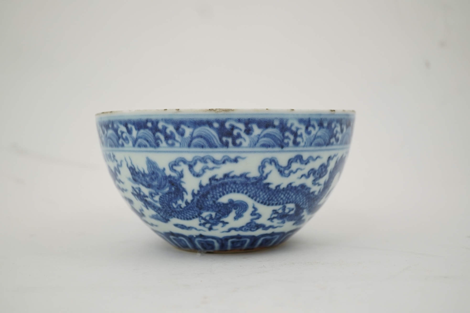 A Chinese blue and white ‘dragon’ dice bowl, Xuande mark, probably late Qing dynasty